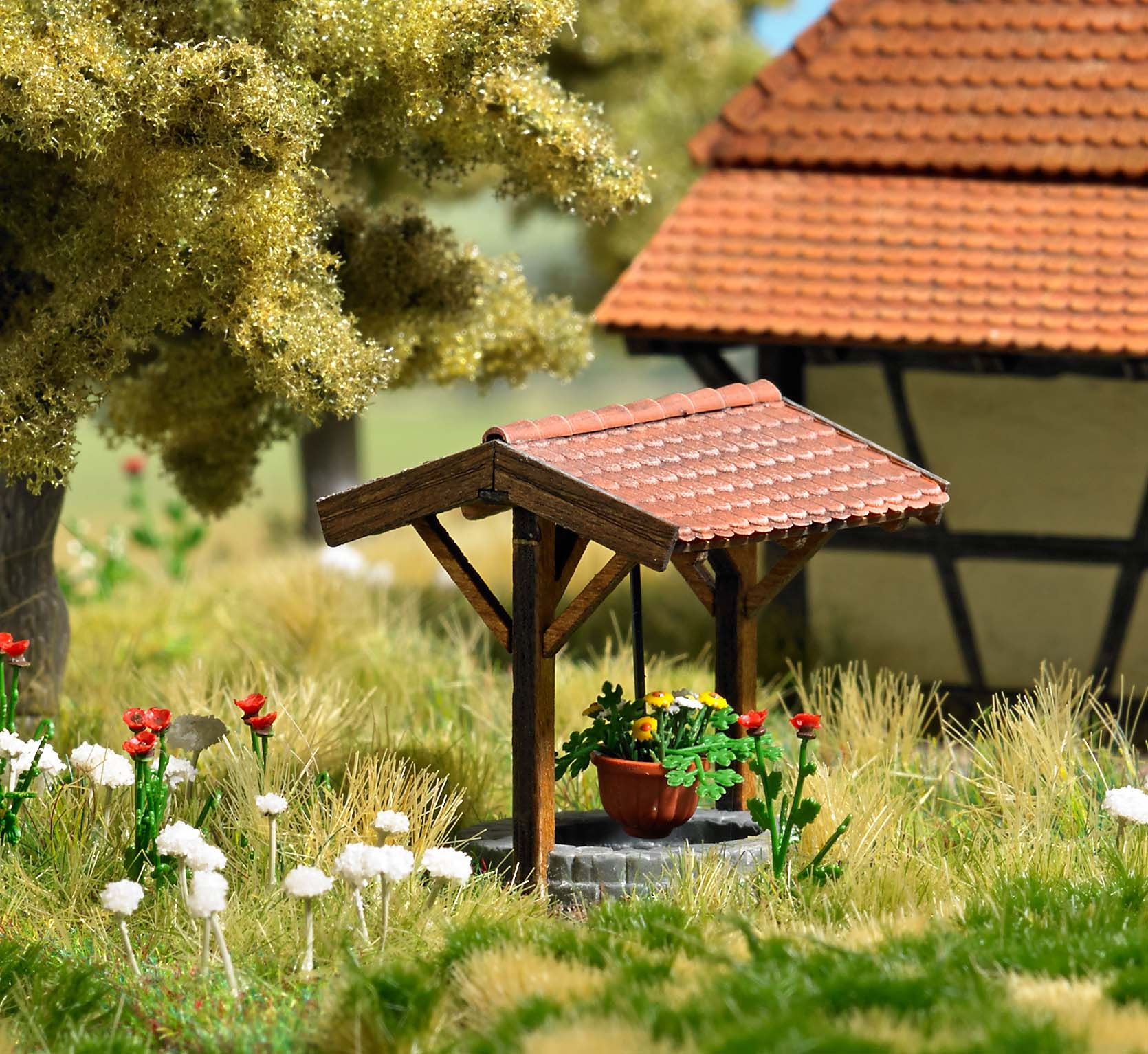 1524 Brunnen mit Blumenampel